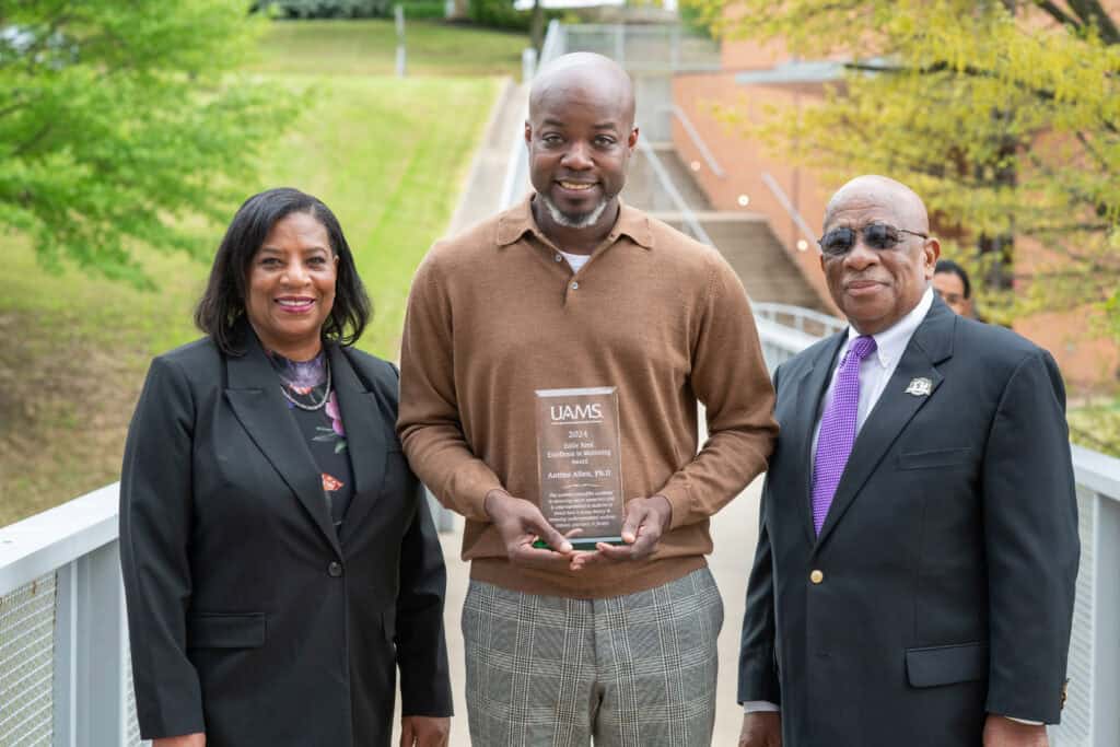 Antiño Allen, Ph.D. pictured receiving the 2024 Award with Beatrice Reed, OD (sister to Dr. Eddie Reed) and Hazel Reed, Ph.D. (brother to Dr. Eddie Reed).